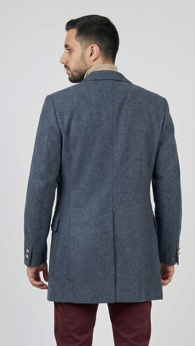 Man wearing a gray coat and red pants on a white background