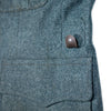 Close-up of 1980s Swiss Army gray-blue wool jacket pocket with Swiss Cross button and flap detail