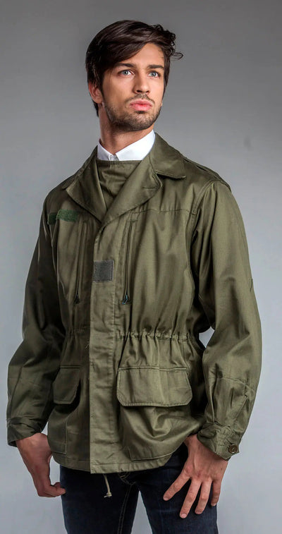 Man wearing olive green M-64 Foreign Legion Field Jacket with button cuffs and spacious pockets