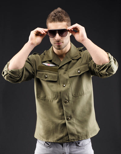 Classic vintage style olive military shirt with button-up design, Austrian Air Force insignia, and two front pockets.