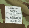Fabric tag with MIRJA s.r.o. branding and washing instructions on a camouflage background