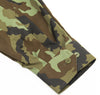 Camouflage-patterned fabric with buttons on a white background