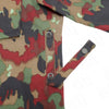 Close-up of a camouflage-patterned fabric with suspenders on a white background