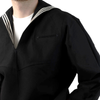 US NAVY MIDDY Man wearing a black sailor-style shirt with white trim on a white background