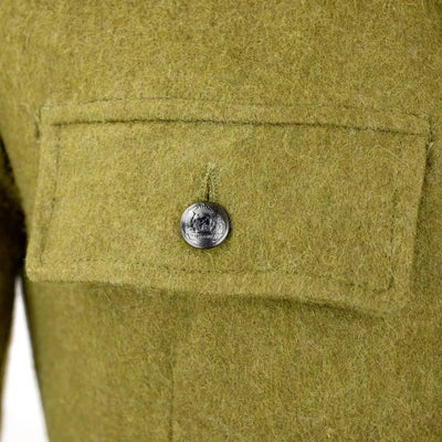 Close-up of Soviet Style Romanian vintage khaki wool jacket pocket with pewter metal button