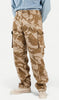 Camouflage pants worn by a person on a white background