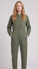 A woman modeling an olive green one-piece jumpsuit with a front zipper, chest pockets, and cargo-style pockets on the legs, photographed against a plain light gray studio background.