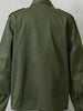 An olive green military-style jacket shown from the back, featuring shoulder epaulets and a classic collar, photographed against a neutral light gray background.