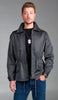 Dark gray combat jacket with slanted pockets, drawstring waist, and Danish coat of arms on shoulder.