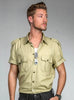 Khaki safari style shirt with epaulettes and army emblem buttons worn by model.