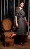 Vintage Swedish two-toned gray dress with white collar and cuffs, featuring button-down design and rifle epaulettes.